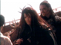 In an act he will soon regret, Borias put one of those deer hat things up 
behind Evil Xena's head